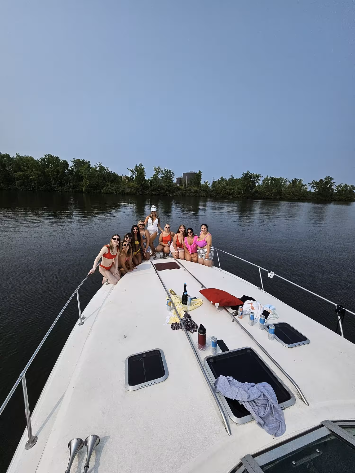 Group on the bow of a yacht